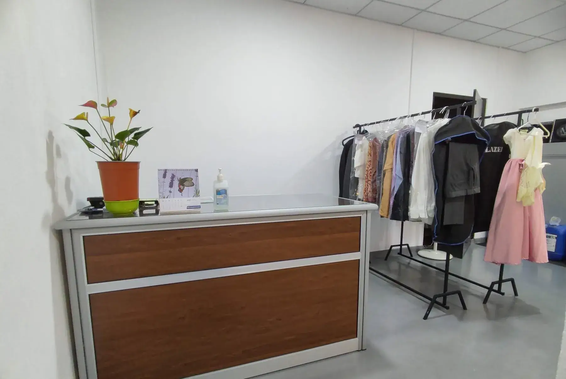 Bright reception counter with freshly cleaned garments at Champion Laundry, Gampaha